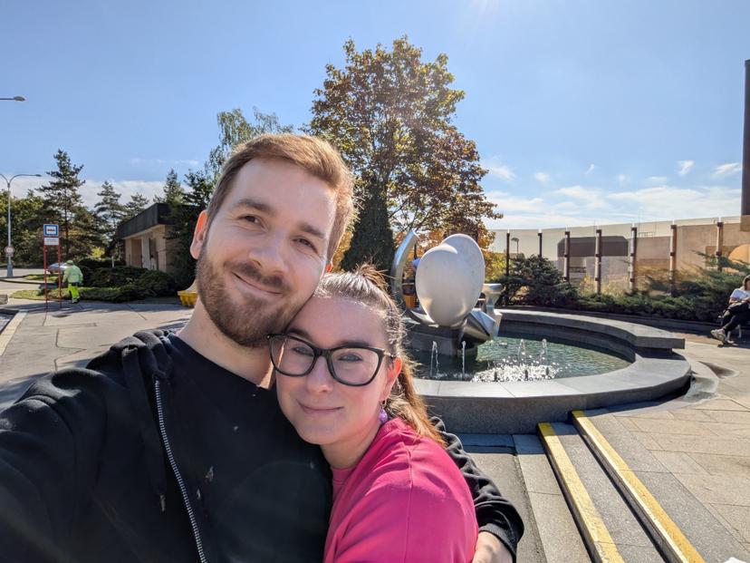 Patrik's wife carrying bags of supplies
